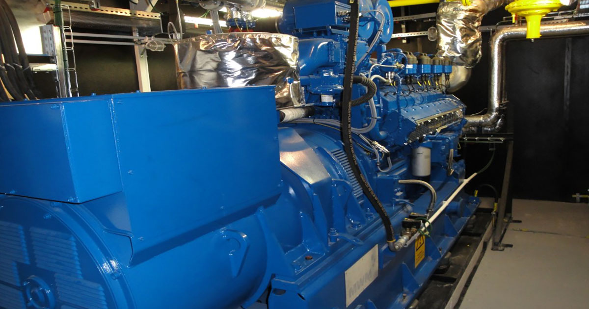 Single visible MWM TCG 2016 V16C gas engine in signature blue at Dalkia Veolia plant in Bratislava, Slovakia, one of 18 gensets for district heating.